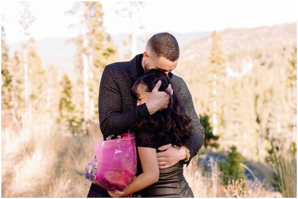 Couple hugging during proposal 