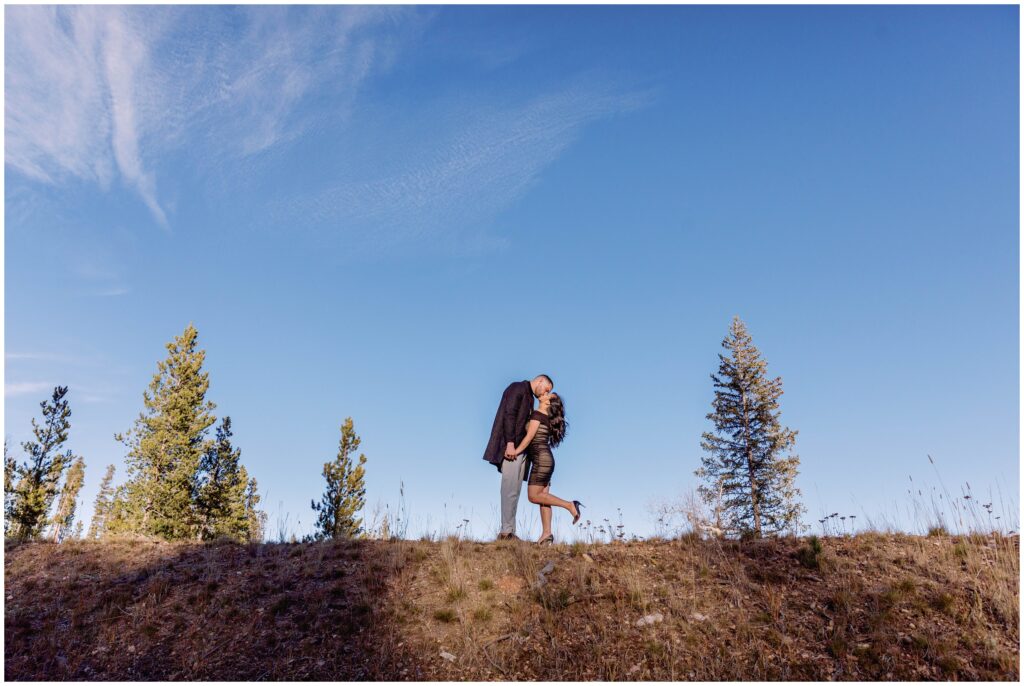 Couple standing on Vail mountain after proposal